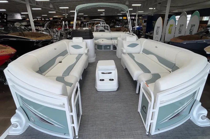 Slide: The Image of 2026 JC Neptoon 25TT Sport pontoon boat with spacious seating in showroom. - 45