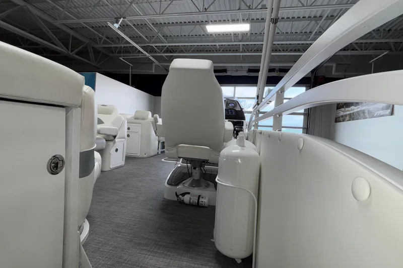 Slide: The Image of Interior of 2026 JC Neptoon 25TT Sport boat with white seating and modern design. - 50