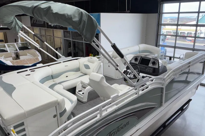 Slide: The Image of 2026 JC Neptoon 25TT Sport pontoon boat with luxurious seating and modern dashboard. - 7