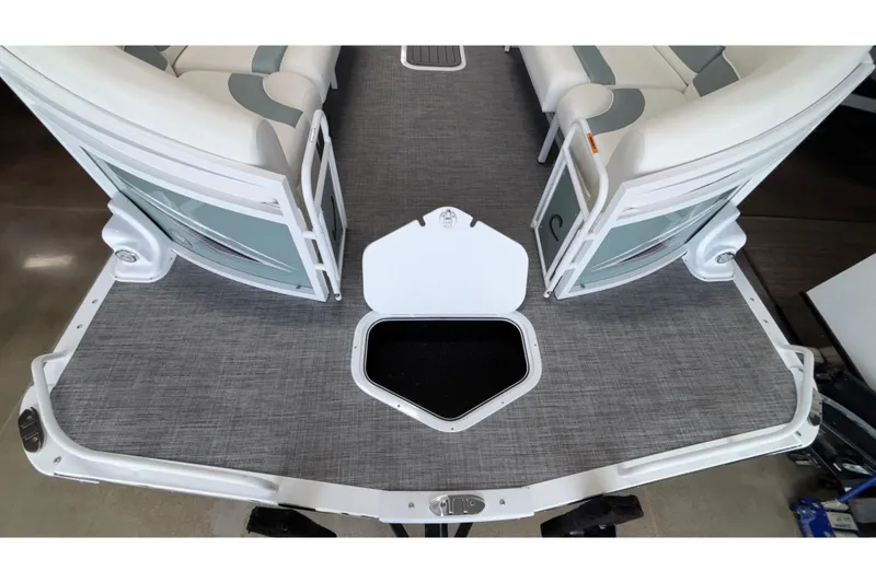 Slide: The Image of 2026 JC Neptoon 25TT Sport pontoon boat with open storage compartment on deck. - 12