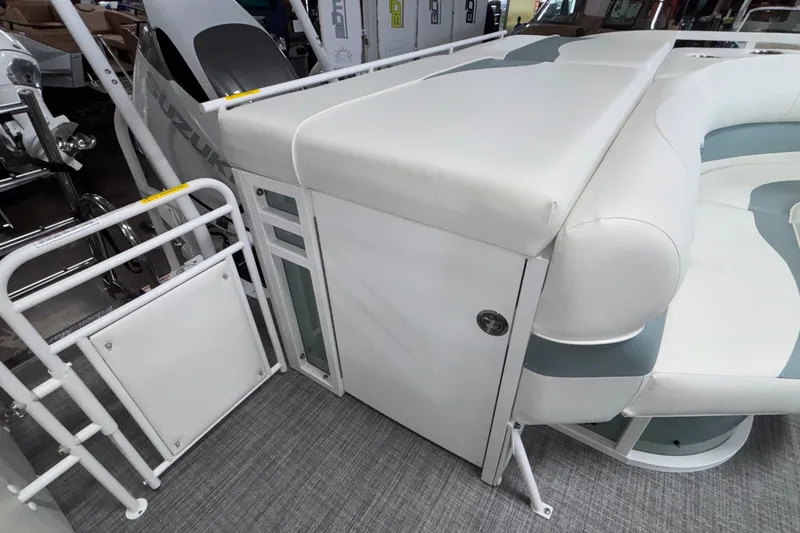 Slide: The Image of 2026 JC Neptoon 25TT Sport boat interior with white seating and storage compartment. - 16