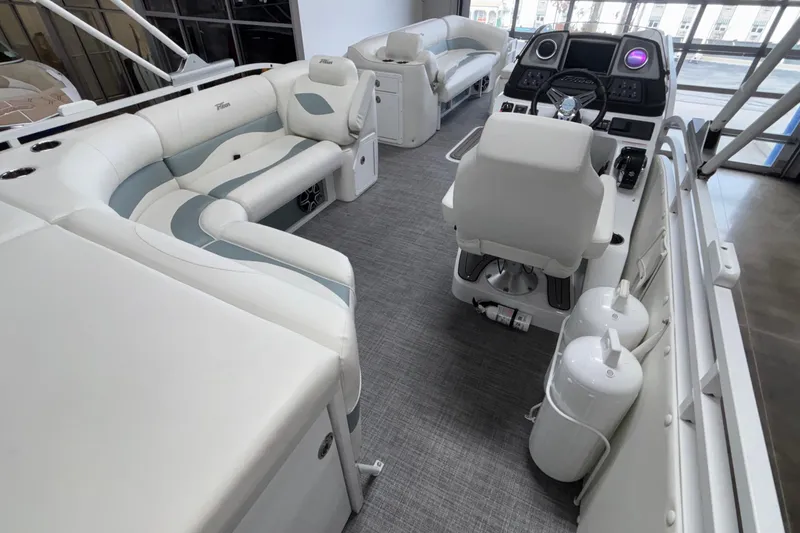 Slide: The Image of Luxurious interior of 2026 JC Neptoon 25TT Sport pontoon boat with plush seating and modern helm. - 17
