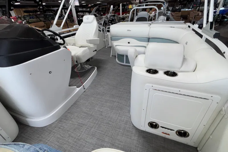 Slide: The Image of Interior of 2026 JC Neptoon 25TT Sport pontoon boat with white seating and helm. - 20