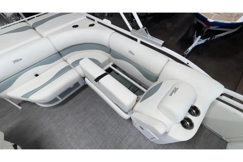 Slide: The Image of 2026 JC Neptoon 25TT Sport boat interior with white and gray seating and cup holders. - 21