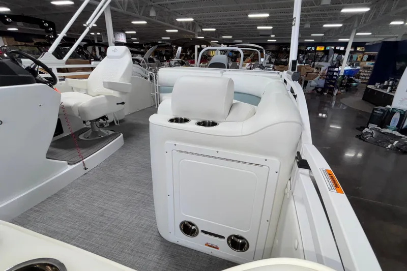 Slide: The Image of 2026 JC Neptoon 25TT Sport boat interior with white seating and modern design. - 23