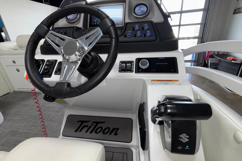Slide: The Image of 2026 JC Neptoon 25TT Sport boat dashboard with steering wheel and controls. - 29