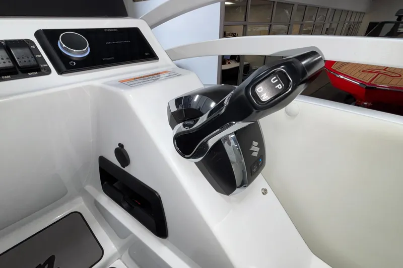 Slide: The Image of Control panel of 2026 JC Neptoon 25TT Sport boat with throttle lever and audio system. - 30
