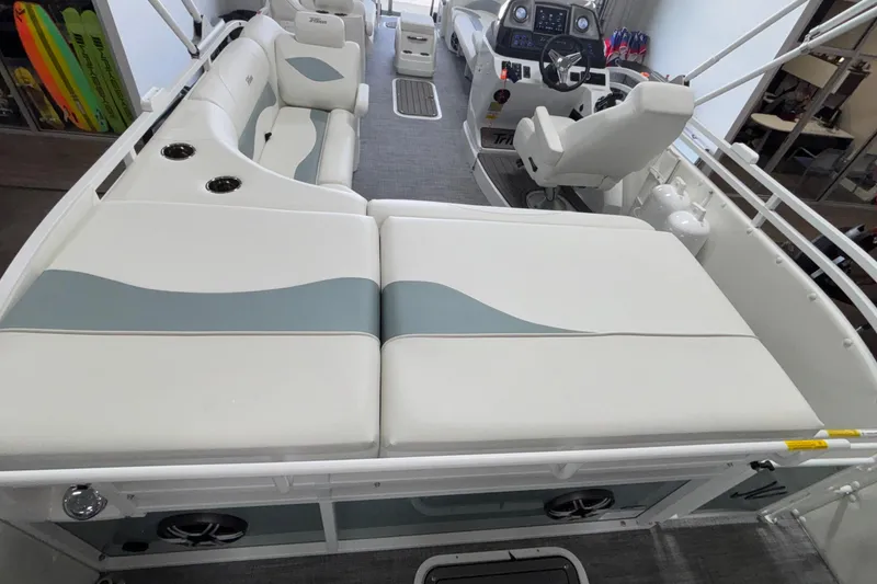 Slide: The Image of 2026 JC Neptoon 25TT Sport boat interior with white seating and modern dashboard. - 33