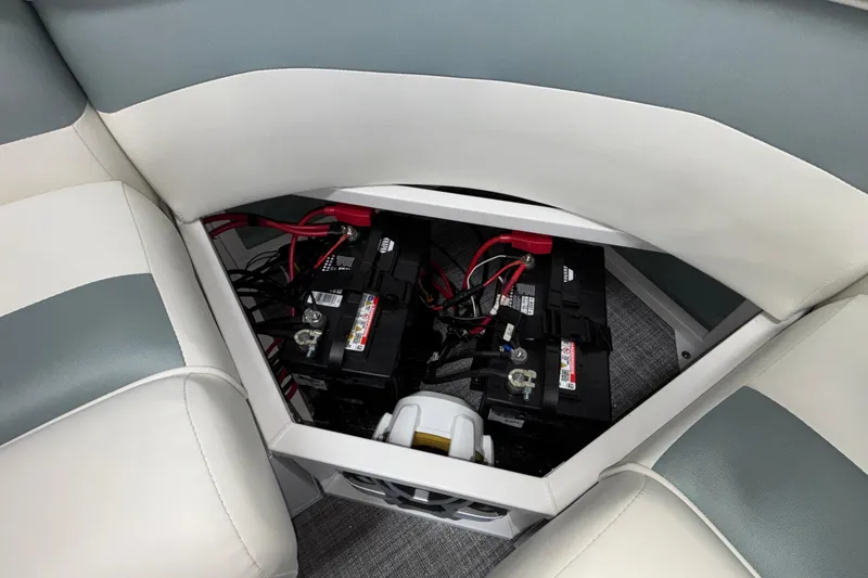 Slide: The Image of Battery compartment of 2026 JC Neptoon 25TT Sport pontoon boat, featuring dual batteries. - 51