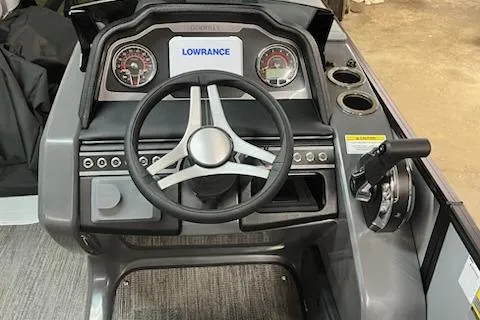 Slide: The Image of Steering console of 2026 MONACO 235SFL boat with Lowrance display and controls. - 12
