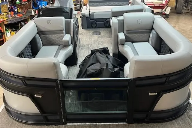 Slide: The Image of 2026 MONACO 235SFL pontoon boat interior with luxurious seating and modern design. - 13