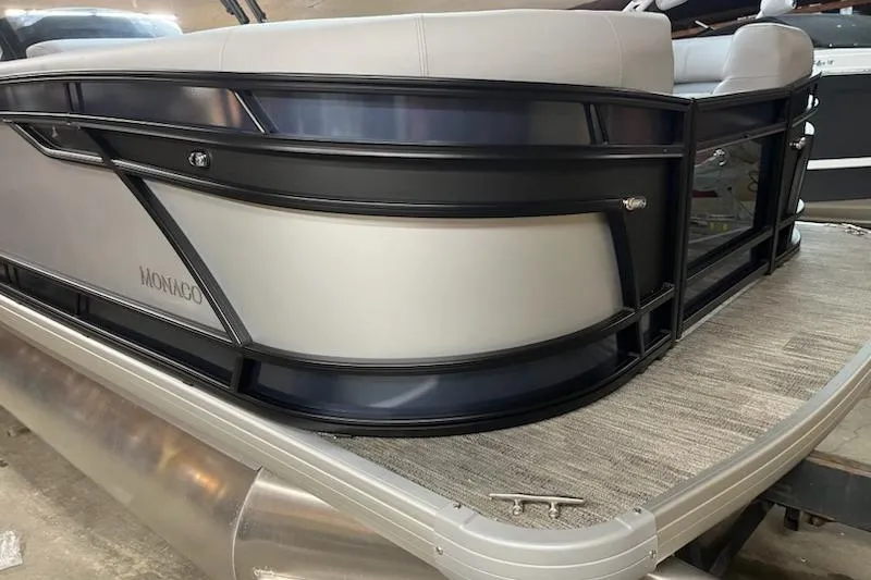 Slide: The Image of 2026 MONACO 235SFL pontoon boat with sleek design and modern seating. - 3