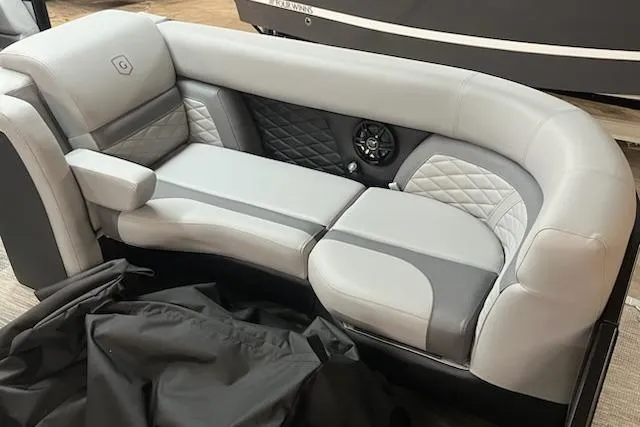 Slide: The Image of Luxurious seating in 2026 MONACO 235SFL boat with quilted upholstery and integrated speaker. - 9