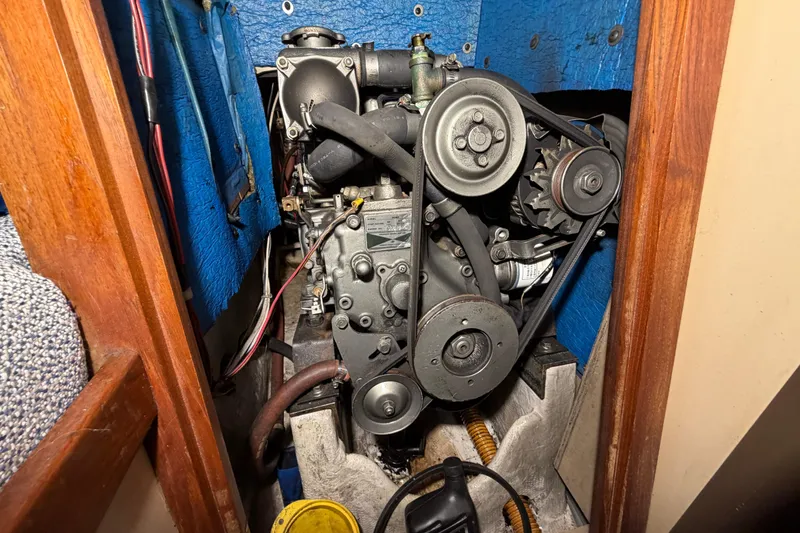 Slide: The Image of Engine compartment of a 1984 C&C 35-3 sailboat, featuring belts and pulleys. - 22