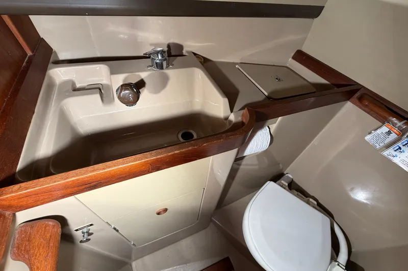 Slide: The Image of Compact bathroom in a 1984 C&C 35-3 sailboat with sink and toilet. - 34
