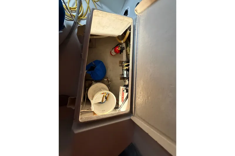Slide: The Image of Storage compartment in 1984 C&C 35-3 sailboat with equipment and supplies. - 35