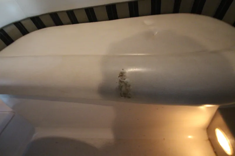 Slide: The Image of 2007 Four Winns 378 Vista interior with minor upholstery damage. - 11