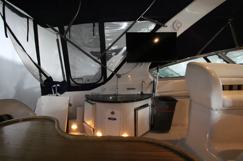 Slide: The Image of Interior of 2007 Four Winns 378 Vista yacht with seating, TV, and kitchenette. - 14