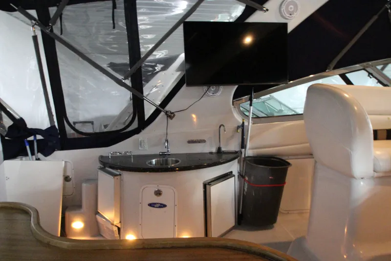 Slide: The Image of Interior of 2007 Four Winns 378 Vista yacht with kitchenette and seating area. - 15