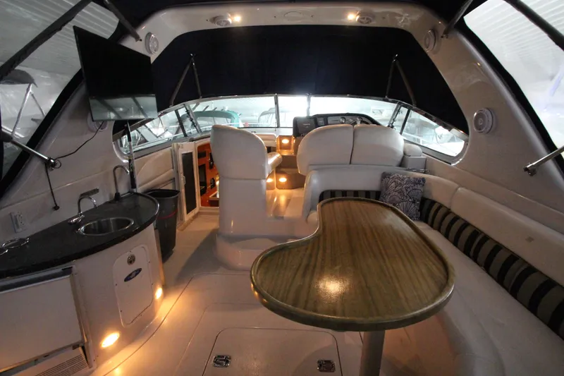 Slide: The Image of Interior of 2007 Four Winns 378 Vista yacht with seating, table, and kitchenette. - 17