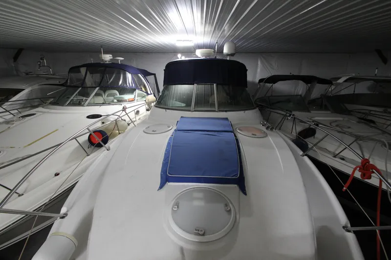 Slide: The Image of 2007 Four Winns 378 Vista yacht docked in a covered marina. - 18