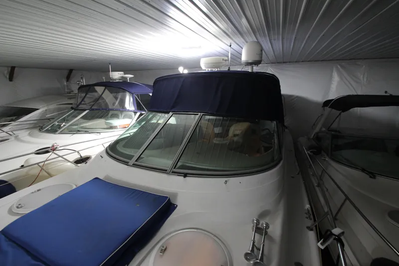 Slide: The Image of 2007 Four Winns 378 Vista boat stored indoors with protective covers. - 20