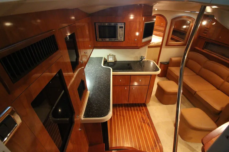 Slide: The Image of Luxurious 2007 Four Winns 378 Vista yacht interior with kitchen and seating area. - 21