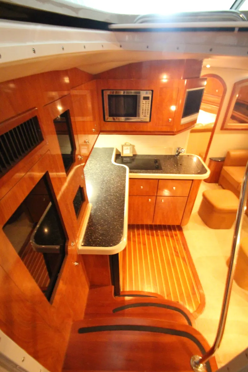 Slide: The Image of 2007 Four Winns 378 Vista yacht interior with modern kitchen and wood finish. - 22