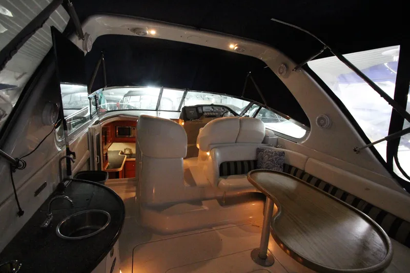 Slide: The Image of 2007 Four Winns 378 Vista yacht interior with seating, table, and helm. - 3