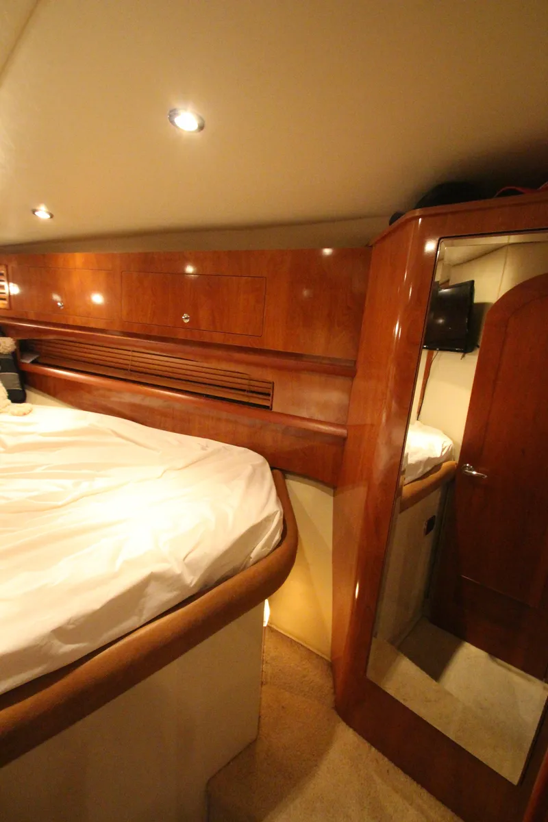 Slide: The Image of Luxurious cabin interior of 2007 Four Winns 378 Vista yacht with wood finish. - 35