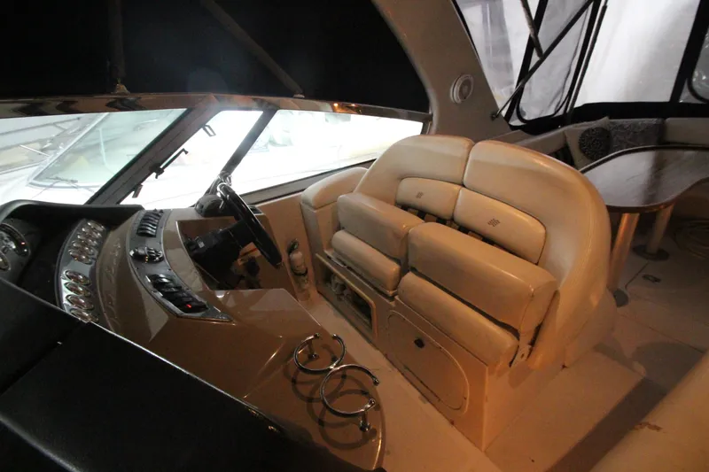 Slide: The Image of Interior of 2007 Four Winns 378 Vista yacht with beige seating and control panel. - 8