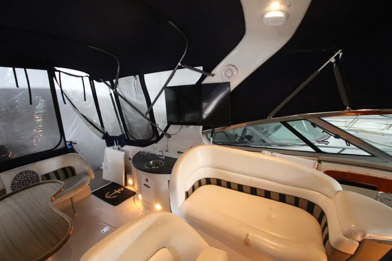 Slide: The Image of 2007 Four Winns 378 Vista yacht interior with seating, TV, and kitchenette. - 9