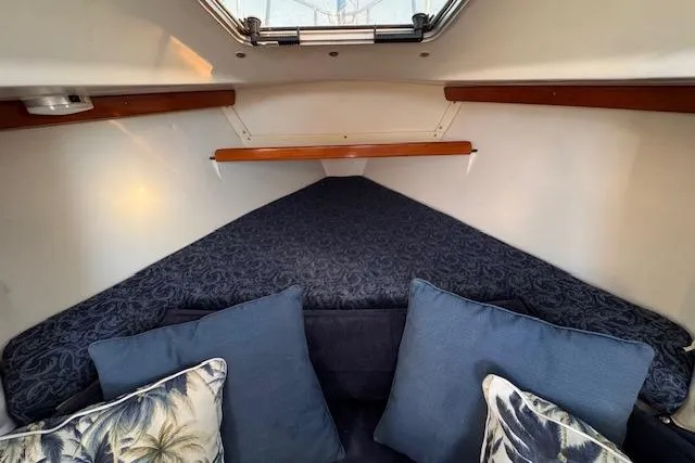 Slide: The Image of Cozy cabin interior of 1994 Catalina 270 sailboat with cushions and bedding. - 18