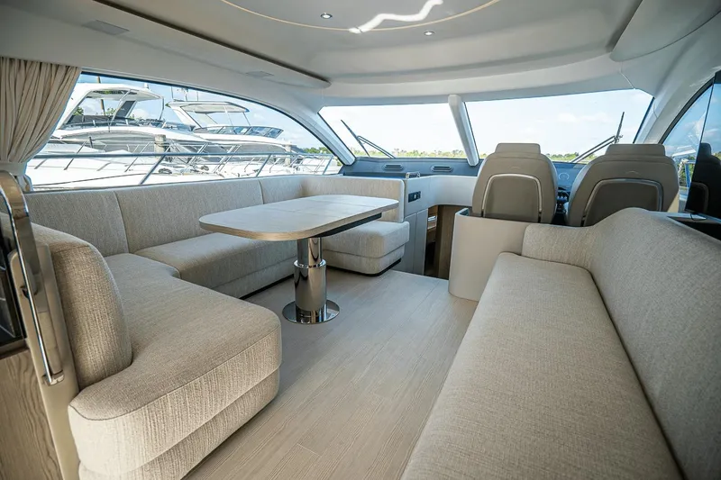 Slide: The Image of Luxurious interior of 2026 Azimut Fly 53 yacht with elegant seating and dining area. - 11