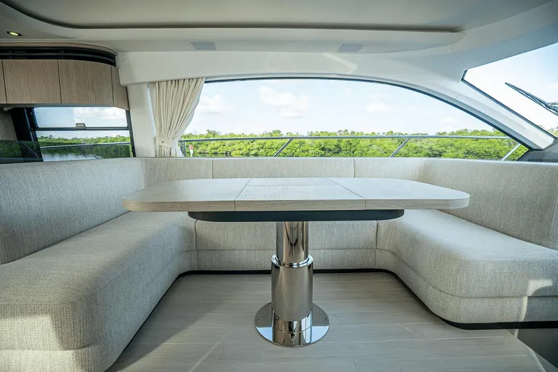 Slide: The Image of Luxurious interior of 2026 Azimut Fly 53 yacht with elegant seating and panoramic windows. - 12