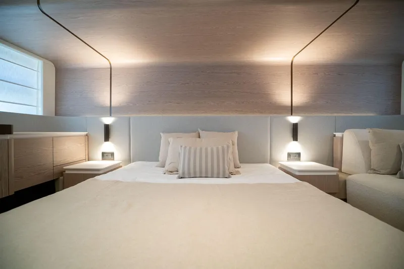 Slide: The Image of Luxurious bedroom interior of 2026 Azimut Fly 53 yacht, featuring modern lighting and elegant design. - 26