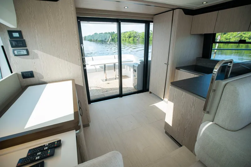 Slide: The Image of Interior of 2026 Azimut Fly 53 yacht with modern design and scenic water view. - 32
