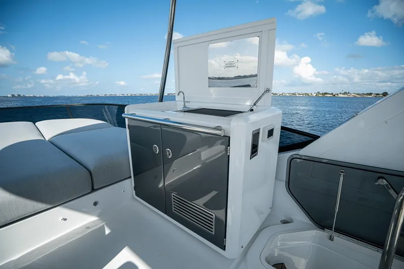 Slide: The Image of 2026 Azimut Fly 53 yacht deck with sleek kitchenette and ocean view. - 36