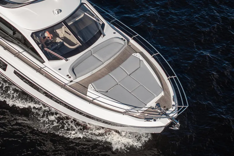 Slide: The Image of Azimut Fly 53 yacht cruising on water, aerial view, 2026 model. - 40