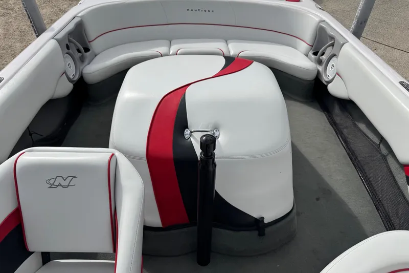 Slide: The Image of 2004 Correct Craft Air Nautique 216 Limited boat interior with red and black accents. - 10