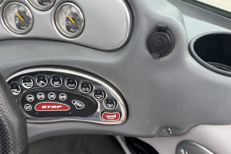 Slide: The Image of Dashboard controls of a 2004 Correct Craft Air Nautique 216 Limited boat. - 14
