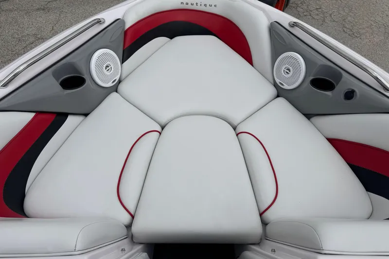 Slide: The Image of 2004 Correct Craft Air Nautique 216 Limited boat interior with white and red seating. - 17
