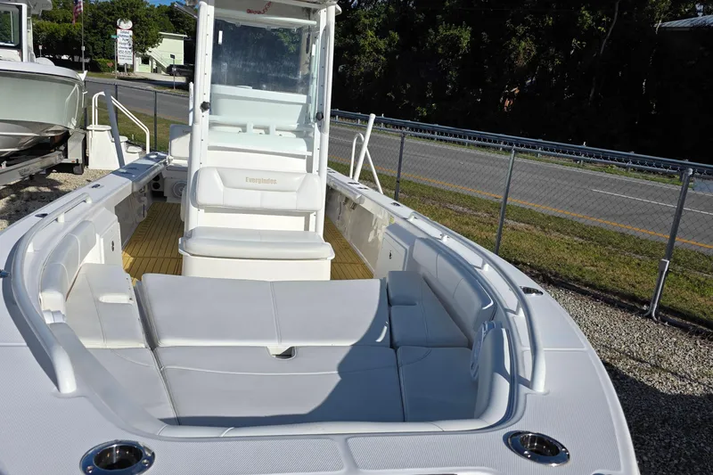 Slide: The Image of 2018 Everglades 243 Center Console boat with spacious seating and sleek design. - 13