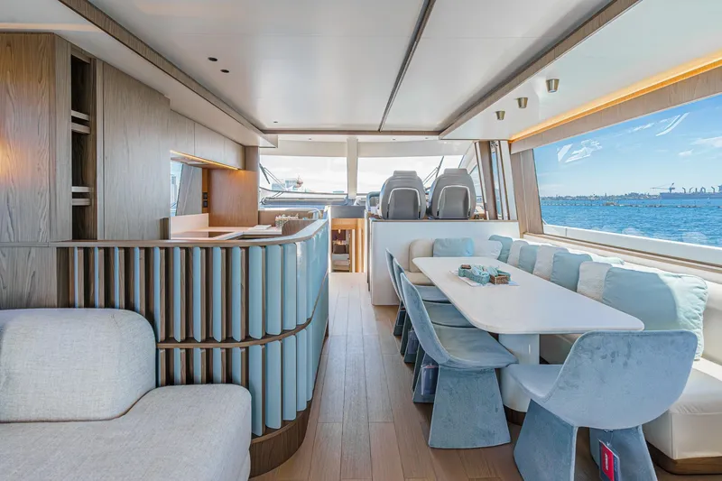 Slide: The Image of Luxurious interior of 2026 Azimut Fly 72 yacht with elegant dining area and sea view. - 12