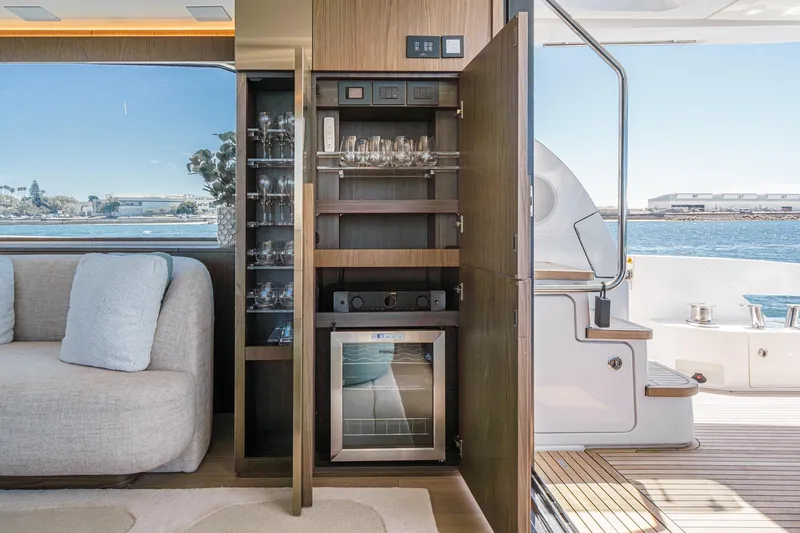 Slide: The Image of Luxurious interior of 2026 Azimut Fly 72 yacht with elegant glassware cabinet. - 14