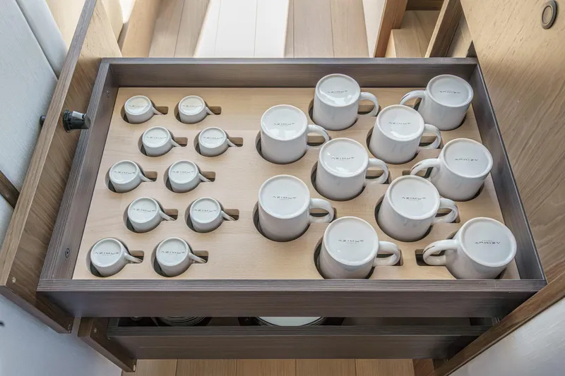 Slide: The Image of Drawer with Azimut-branded mugs on the 2026 Azimut Fly 72 yacht. - 16