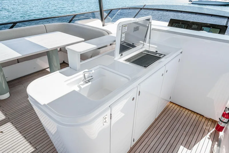 Slide: The Image of Luxury outdoor kitchen on 2026 Azimut Fly 72 yacht, featuring sleek design and ocean view. - 6