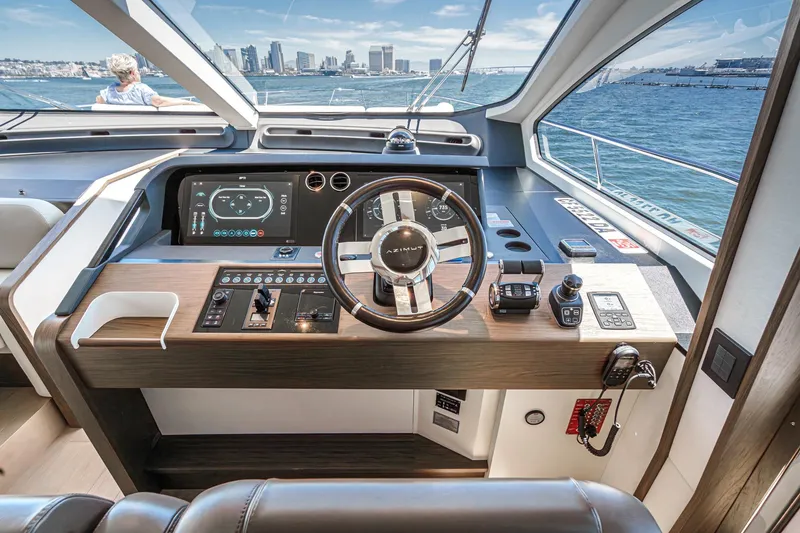 Slide: The Image of Cockpit of 2026 Azimut Fly 72 yacht with modern controls and ocean view. - 9