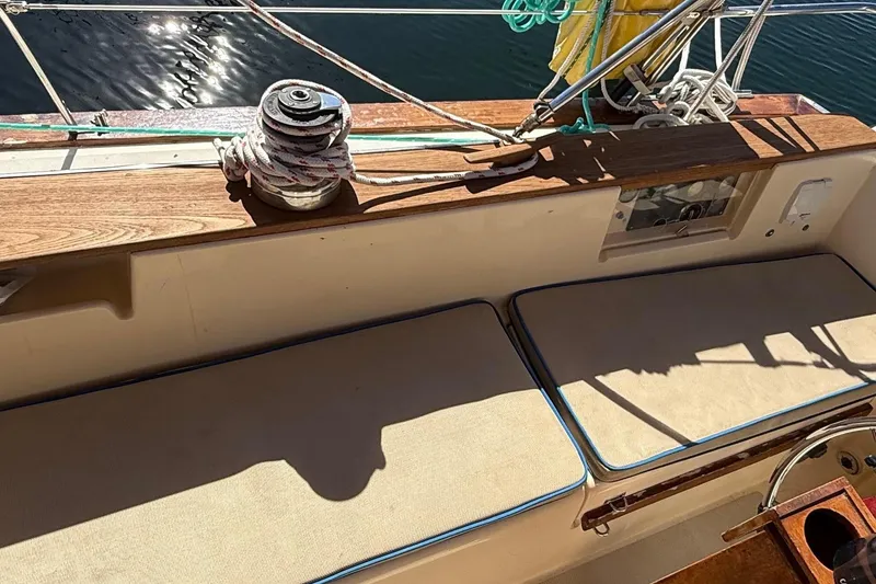 Slide: The Image of Cockpit of 1991 Island Packet 35 sailboat with seating cushions. - 13