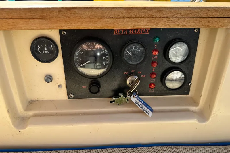 Slide: The Image of Control panel of a 1991 Island Packet 35 sailboat with Beta Marine engine gauges. - 14